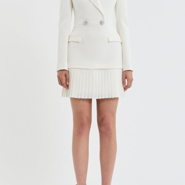 exuding modern sophistication. Highlighting a blazer dress silhouette