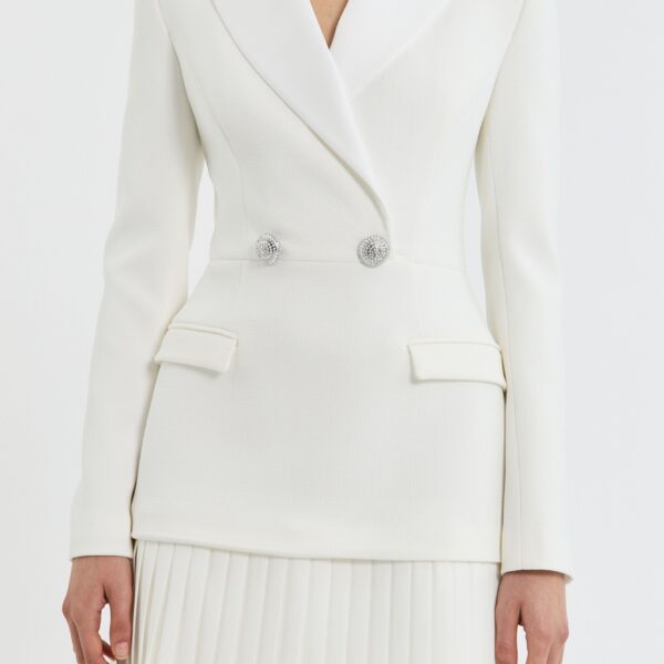 the A-line mini skirt is detailed with a pleated hem underlay
