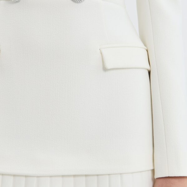 while an invisible zip fastening at the back ensures a secure fit. Lined for comfort