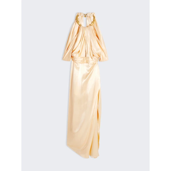 Schiaparelli black dress featuring gold bamboo shaped hardware straps and buttons