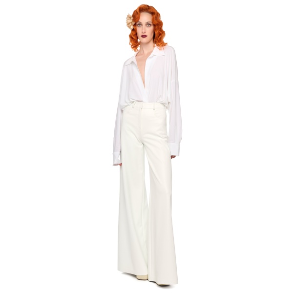 Elevate your elegance in this Norma Kamali  from the resort wear edit