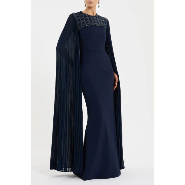 the crew neckline and fitted bodice beautifully sculpt the figure