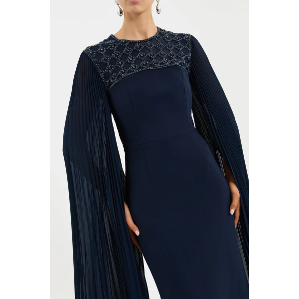 detailed with a back split for ease of wear. Lined for comfort and secured with a zip fastening at the back