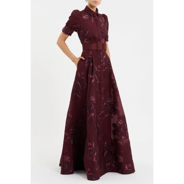 complementing the voluminous circular maxi skirt that shapes a flattering silhouette. Polished with side seam pockets and a concealed placket for a seamless finish