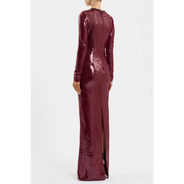 elevated by the long sleeves and fitted bodice. The column maxi skirt shapes an elegant silhouette