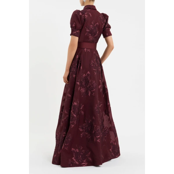 the gown includes a removable slip dress with adjustable straps for added versatility.