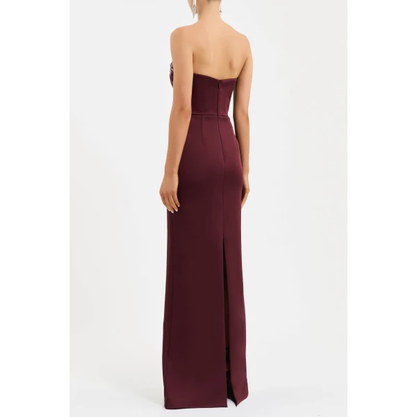 cinched at the waist to accentuate its flattering fit. The column maxi skirt creates an elegant silhouette