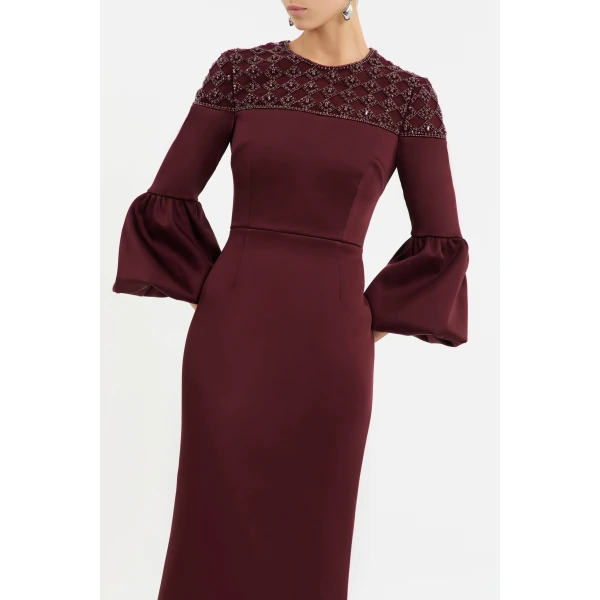 enhanced with a back split for ease of wear. Fully lined and secured with a zip fastening at the back