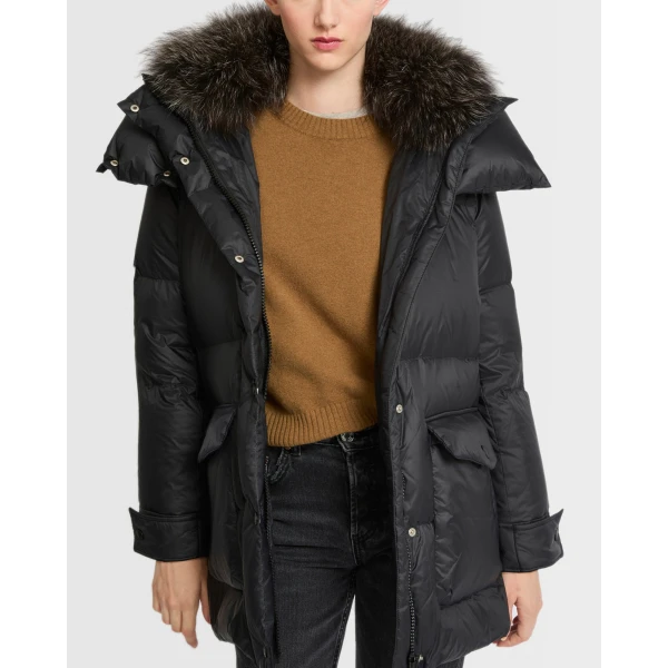 Woman wearing Yves Salomon shearling fur coat – luxury outerwear at Luxury Shoes 