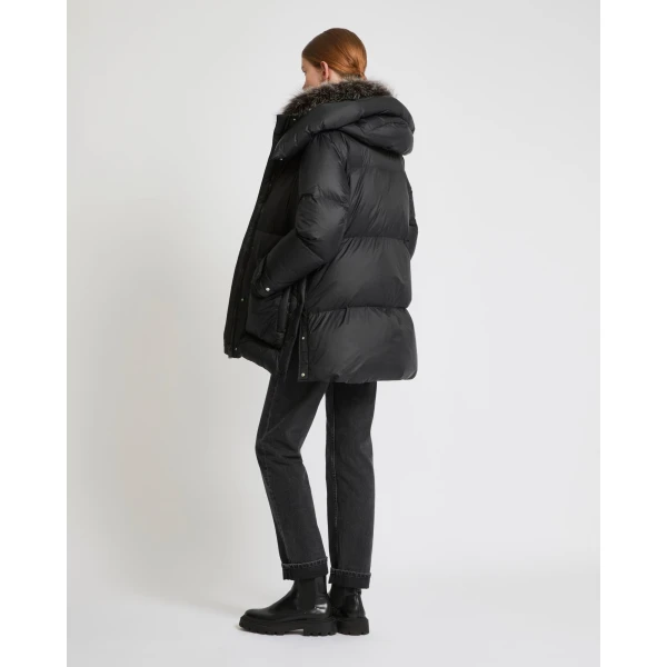 Woman wearing Yves Salomon shearling fur coat – luxury outerwear at Luxury Shoes 
