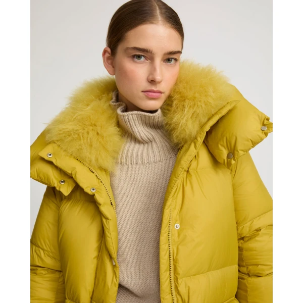 Woman wearing Yves Salomon shearling fur coat – luxury outerwear at Luxury Shoes 