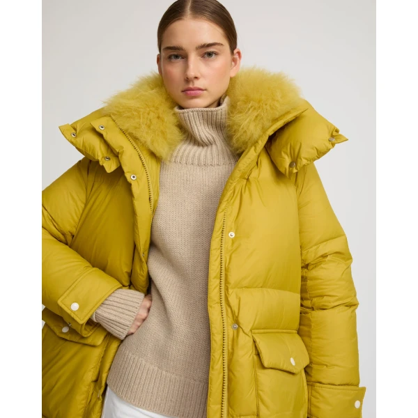Woman wearing Yves Salomon shearling fur coat – luxury outerwear at Luxury Shoes 