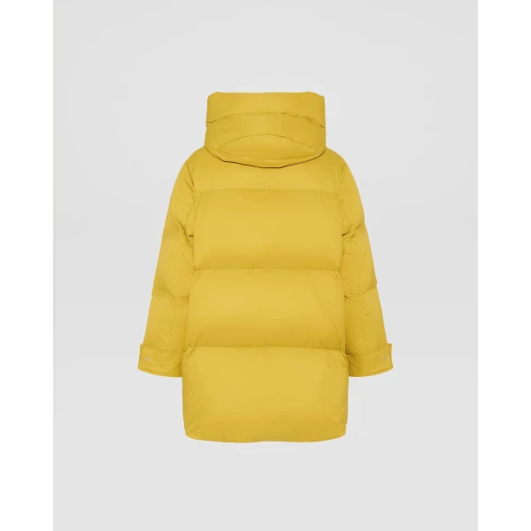 Woman wearing Yves Salomon shearling fur coat – luxury outerwear at Luxury Shoes 
