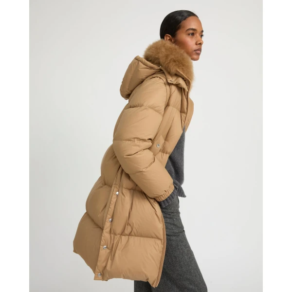 Woman wearing Yves Salomon shearling fur coat – luxury outerwear at Luxury Shoes 