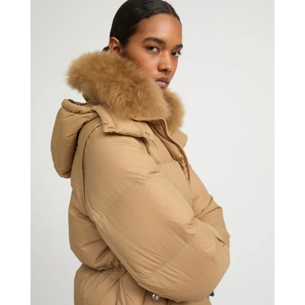Woman wearing Yves Salomon shearling fur coat – luxury outerwear at Luxury Shoes 