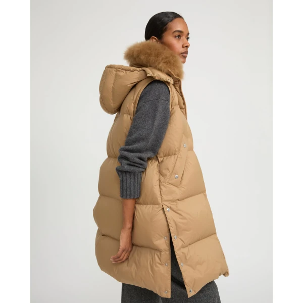 Woman wearing Yves Salomon shearling fur coat – luxury outerwear at Luxury Shoes 