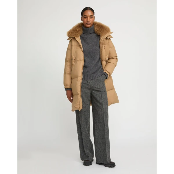 Woman wearing Yves Salomon shearling fur coat – luxury outerwear at Luxury Shoes 