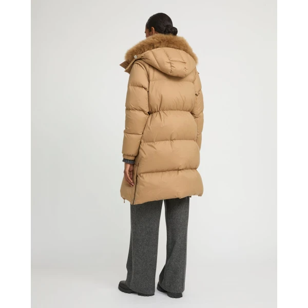 Woman wearing Yves Salomon shearling fur coat – luxury outerwear at Luxury Shoes 