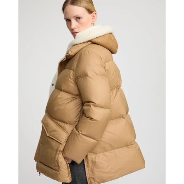Woman wearing Yves Salomon shearling fur coat – luxury outerwear at Luxury Shoes 