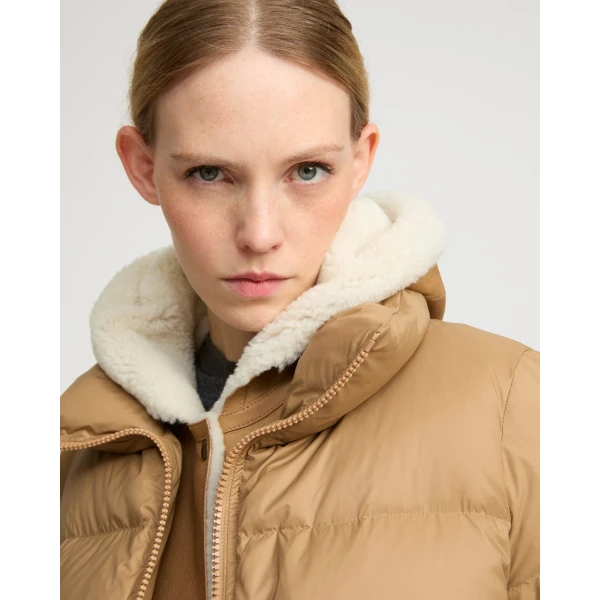 Woman wearing Yves Salomon shearling fur coat – luxury outerwear at Luxury Shoes 