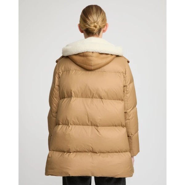 Woman wearing Yves Salomon shearling fur coat – luxury outerwear at Luxury Shoes 