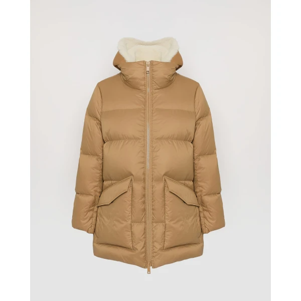 Woman wearing Yves Salomon shearling fur coat – luxury outerwear at Luxury Shoes 