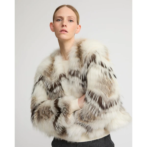 Woman wearing Yves Salomon shearling fur coat – luxury outerwear at Luxury Shoes 