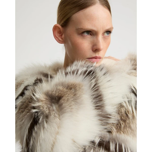 Woman wearing Yves Salomon shearling fur coat – luxury outerwear at Luxury Shoes 