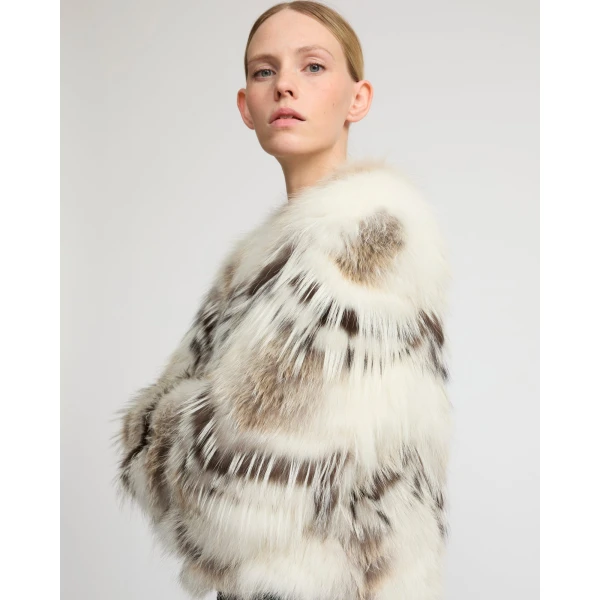Woman wearing Yves Salomon shearling fur coat – luxury outerwear at Luxury Shoes 
