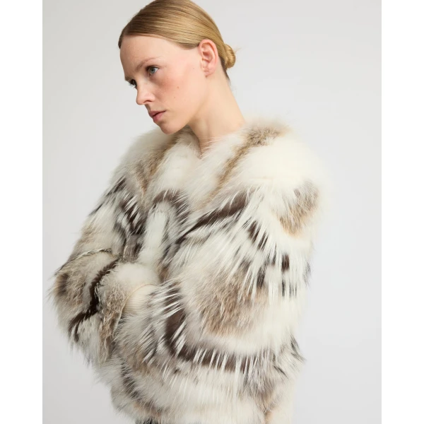 Woman wearing Yves Salomon shearling fur coat – luxury outerwear at Luxury Shoes 