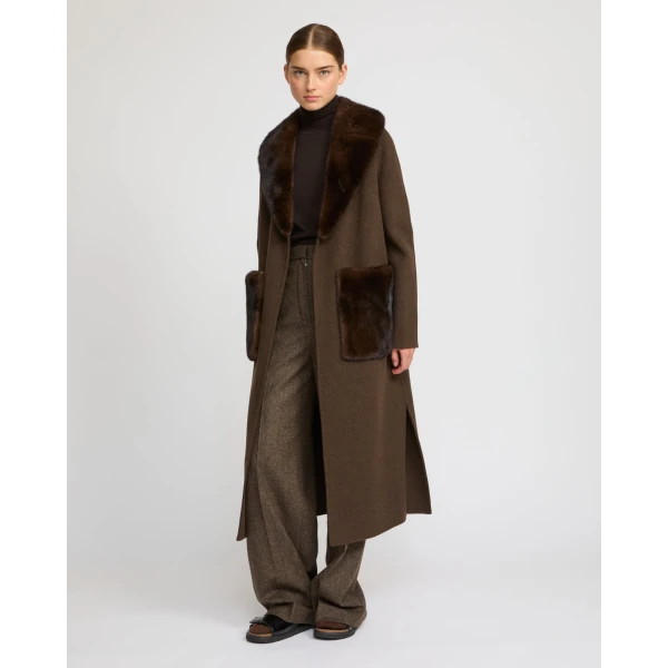 Woman wearing Yves Salomon shearling fur coat – luxury outerwear at Luxury Shoes 