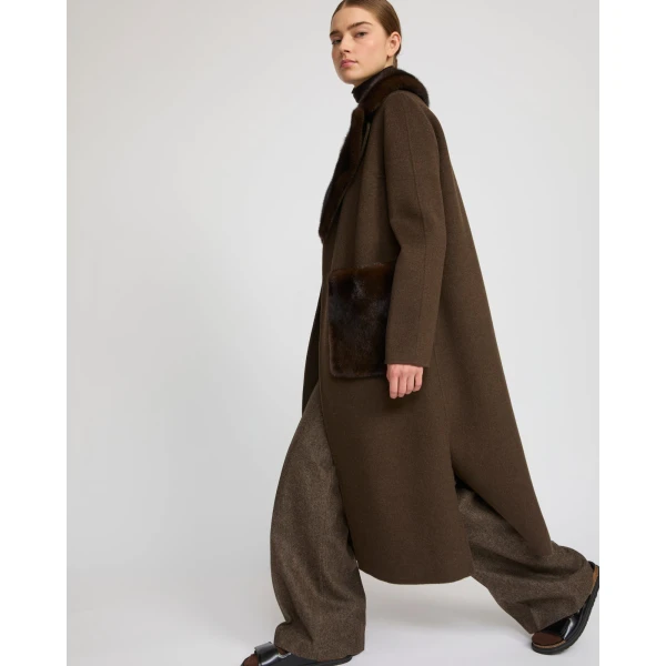 Woman wearing Yves Salomon shearling fur coat – luxury outerwear at Luxury Shoes 