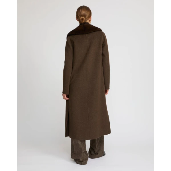 Woman wearing Yves Salomon shearling fur coat – luxury outerwear at Luxury Shoes 