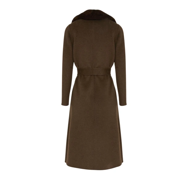 Woman wearing Yves Salomon shearling fur coat – luxury outerwear at Luxury Shoes 
