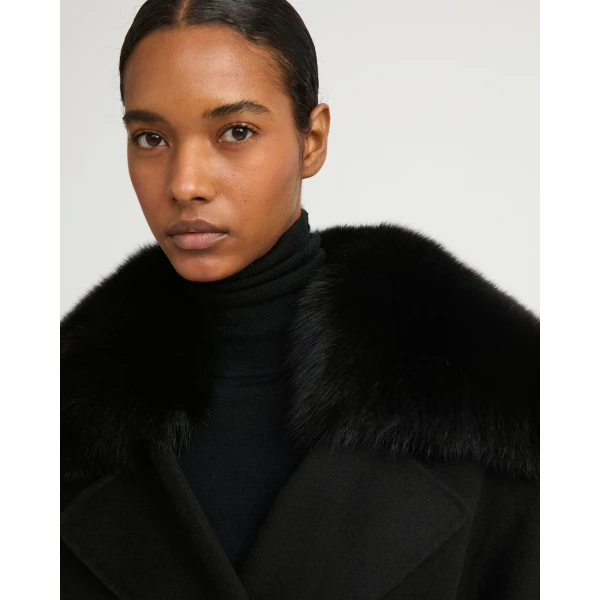 Woman wearing Yves Salomon shearling fur coat – luxury outerwear at Luxury Shoes 