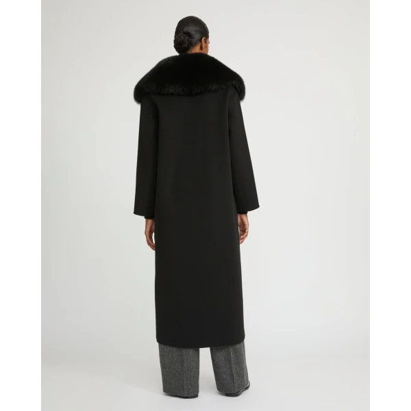 Woman wearing Yves Salomon shearling fur coat – luxury outerwear at Luxury Shoes 