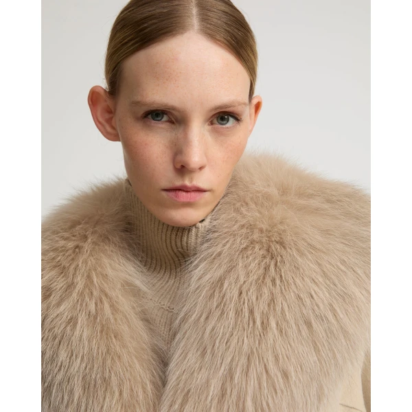 Woman wearing Yves Salomon shearling fur coat – luxury outerwear at Luxury Shoes 