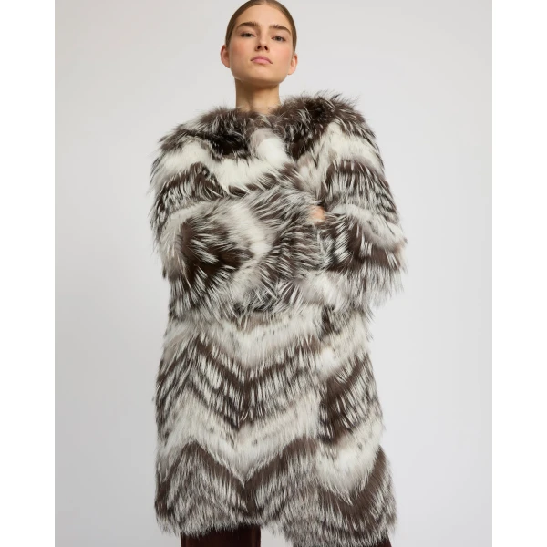 Woman wearing Yves Salomon shearling fur coat – luxury outerwear at Luxury Shoes 