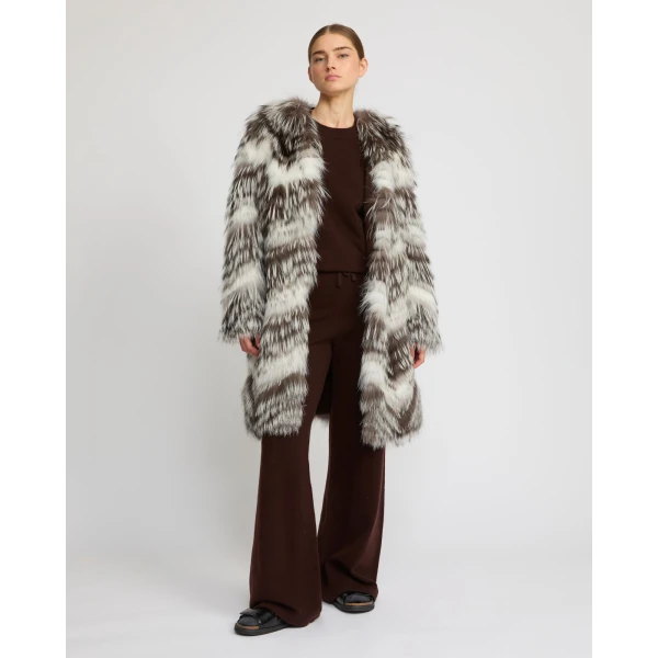 Woman wearing Yves Salomon shearling fur coat – luxury outerwear at Luxury Shoes 
