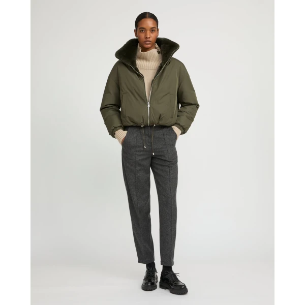 Woman wearing Yves Salomon shearling fur coat – luxury outerwear at Luxury Shoes 