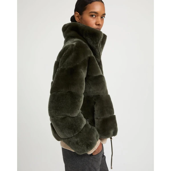 Woman wearing Yves Salomon shearling fur coat – luxury outerwear at Luxury Shoes 