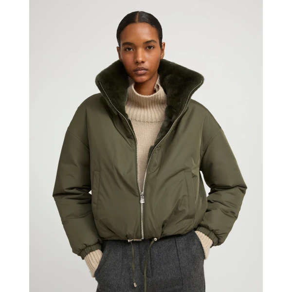 Woman wearing Yves Salomon shearling fur coat – luxury outerwear at Luxury Shoes 