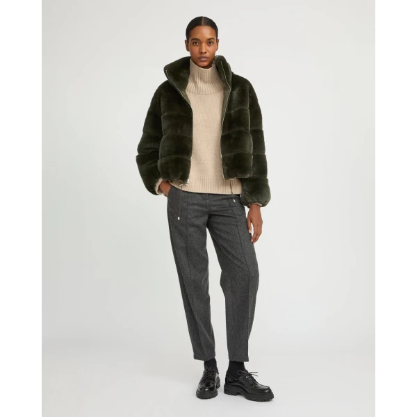 Woman wearing Yves Salomon shearling fur coat – luxury outerwear at Luxury Shoes 