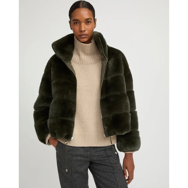 Woman wearing Yves Salomon shearling fur coat – luxury outerwear at Luxury Shoes 