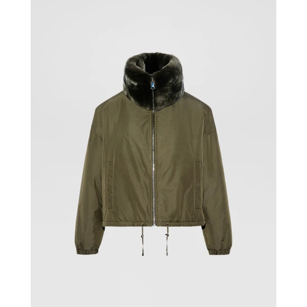 Woman wearing Yves Salomon shearling fur coat – luxury outerwear at Luxury Shoes 