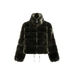 Woman wearing Yves Salomon shearling fur coat – luxury outerwear at Luxury Shoes 