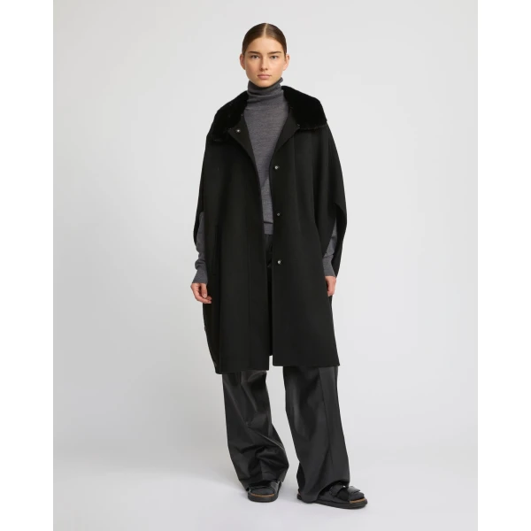 Woman wearing Yves Salomon shearling fur coat – luxury outerwear at Luxury Shoes 