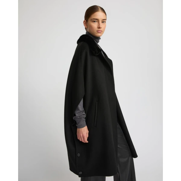 Woman wearing Yves Salomon shearling fur coat – luxury outerwear at Luxury Shoes 