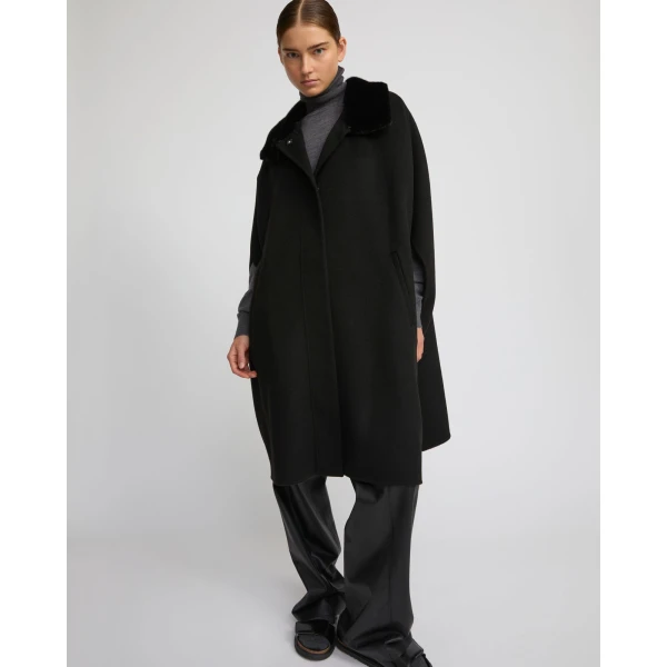 Woman wearing Yves Salomon shearling fur coat – luxury outerwear at Luxury Shoes 
