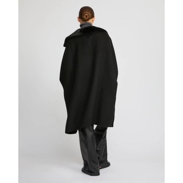 Woman wearing Yves Salomon shearling fur coat – luxury outerwear at Luxury Shoes 